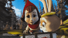 a little red riding hood is standing next to a rabbit in a fandango movie clip