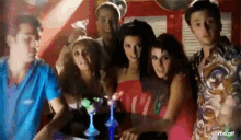 a group of people are posing for a picture with a gif that says rbd.gif