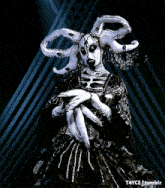a woman in a black and white costume with the words t4y on the bottom left