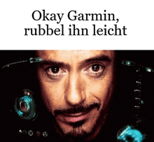 a close up of a man 's face with the words " okay garmin rubbel ihn leicht " below it
