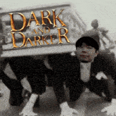 a poster for dark and darker has a man in a suit on it