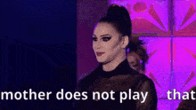 a woman in a black dress is standing in front of a purple background and says mother does not play that .
