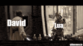 a man and a robot are standing next to each other and the robot says lua