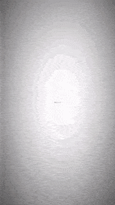 a gray background with a white circle in the middle .