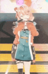 a girl in a blue dress is standing on a stage with her eyes closed