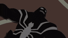 a close up of a spiderman laying on the ground