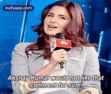 a woman is holding a microphone and says akshay kumar would not like that comment for sure .