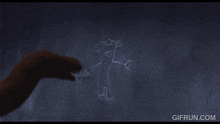a gif from gifrun.com shows a drawing of a snake on a wall
