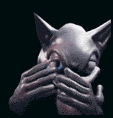 a statue of a cat with its mouth open
