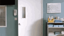 a room with a white board that says unit a-13 on it