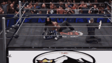 a wrestling ring with a nb logo on the ground