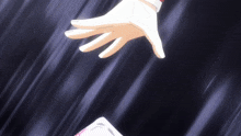 a person 's hand is reaching out to another person