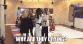 a group of people standing in a room with the words " why are they crying " on the bottom
