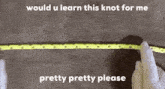 a person wearing white gloves is measuring a yellow ribbon with a tape measure .