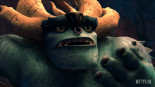 a close up of a monster with horns and a netflix logo