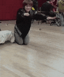 a person is kneeling on the floor with the number 21 on the floor