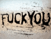 the word fuck you is written on a white surface