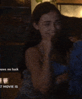 a woman is laying on a couch laughing with the words " have no luck " below her