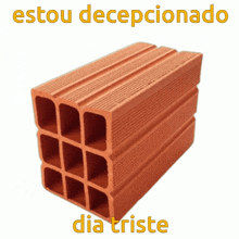 a stack of bricks with the words estou decepcionado dia triste below them