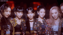 a group of girls are posing for a picture with the words honeycam.org in the upper right corner
