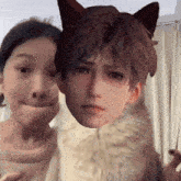 a girl making a face next to a cat with a face of a boy on it