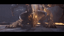 a statue of a monster with horns and claws