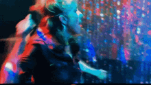 a woman singing into a microphone in a club