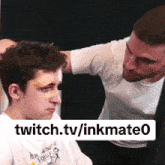 a man with a bandage on his forehead is talking to another man with a bandage on his face
