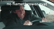 a man driving a car with the words " no flamethrower gyat " written on the screen