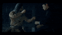 a person 's fist is against a red background