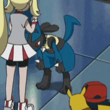 a girl and a pokemon are standing next to each other in a cartoon .