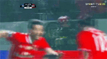 a blurry picture of soccer players on a sport tv channel