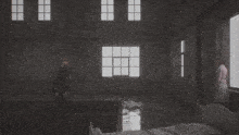 a man and a woman are standing in a room with a bed