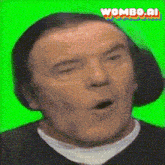 a pixelated image of a man on a green screen with the words wombo.ai written below him