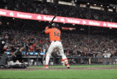 a baseball player with the number 14 on the back of his shirt