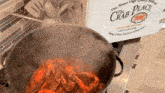 a crab place box sits next to a pot of food