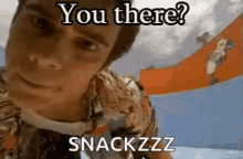 a close up of a man 's face with the words `` you there ? snackzzz '' on it .