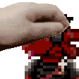 a pixelated image of a hand holding a red item