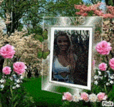 a picture of a woman in a frame with pink flowers and butterflies