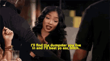 a woman is talking to a group of people and says i 'll find the dumpster you live in