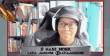 a woman wearing glasses and a hat with the name d hanf monk written on it