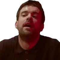 a man with a beard and a black shirt is making a funny face