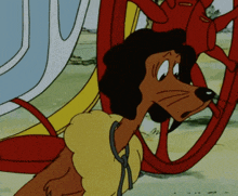 a cartoon dog is tied to a wheel in a sleigh