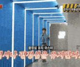 a man is walking down a hallway with a sign that says jyp on it