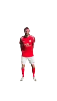 a man in a red pb shirt and shorts is running
