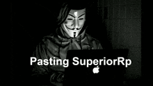 a person wearing a mask is using an apple laptop computer