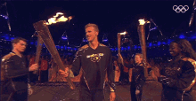 Athlete Fire Up The Flame London2012 GIF - Athlete Fire Up The Flame London2012 Olympic Flame GIFs