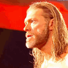 a man with long blonde hair and a beard has the hashtag #thenextbig thing on his face