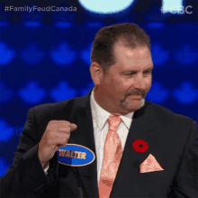 a man in a suit has a name tag that says walter on it