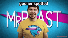 a man wearing a mrbeast shirt stands in front of a blue background